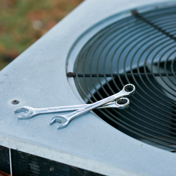HVAC unit with tools on top
