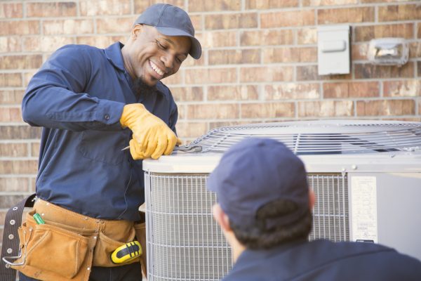 Air conditioner repairmen at work.